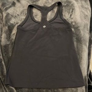 Size 2 lululemon racer back tank top! Very lightly used, zero flaws and stains.